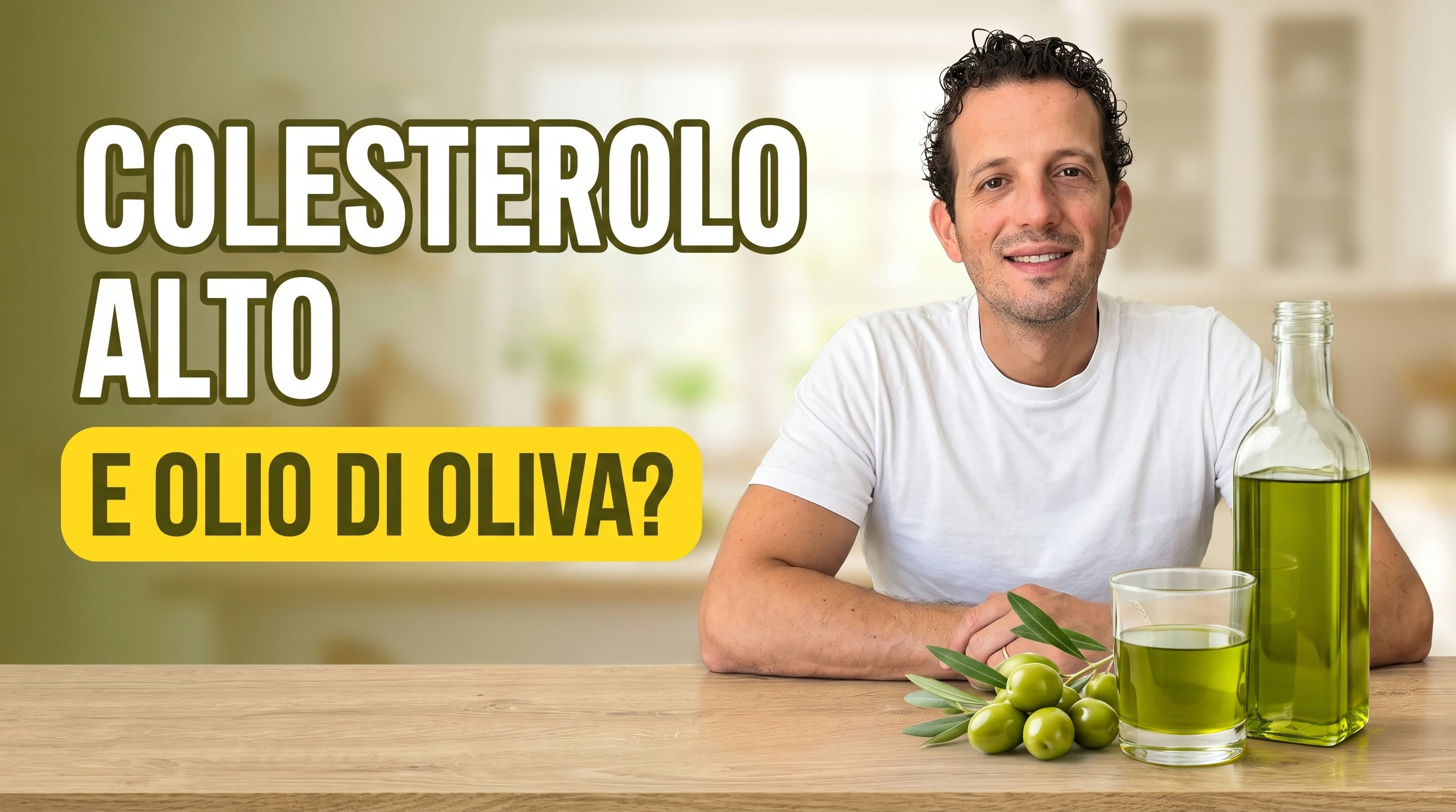 Antonio Carbone con una bottiglia e un bicchiere di olio extravergine di oliva verde e olive fresche: chi ha il colesterolo alto può usare olio di oliva