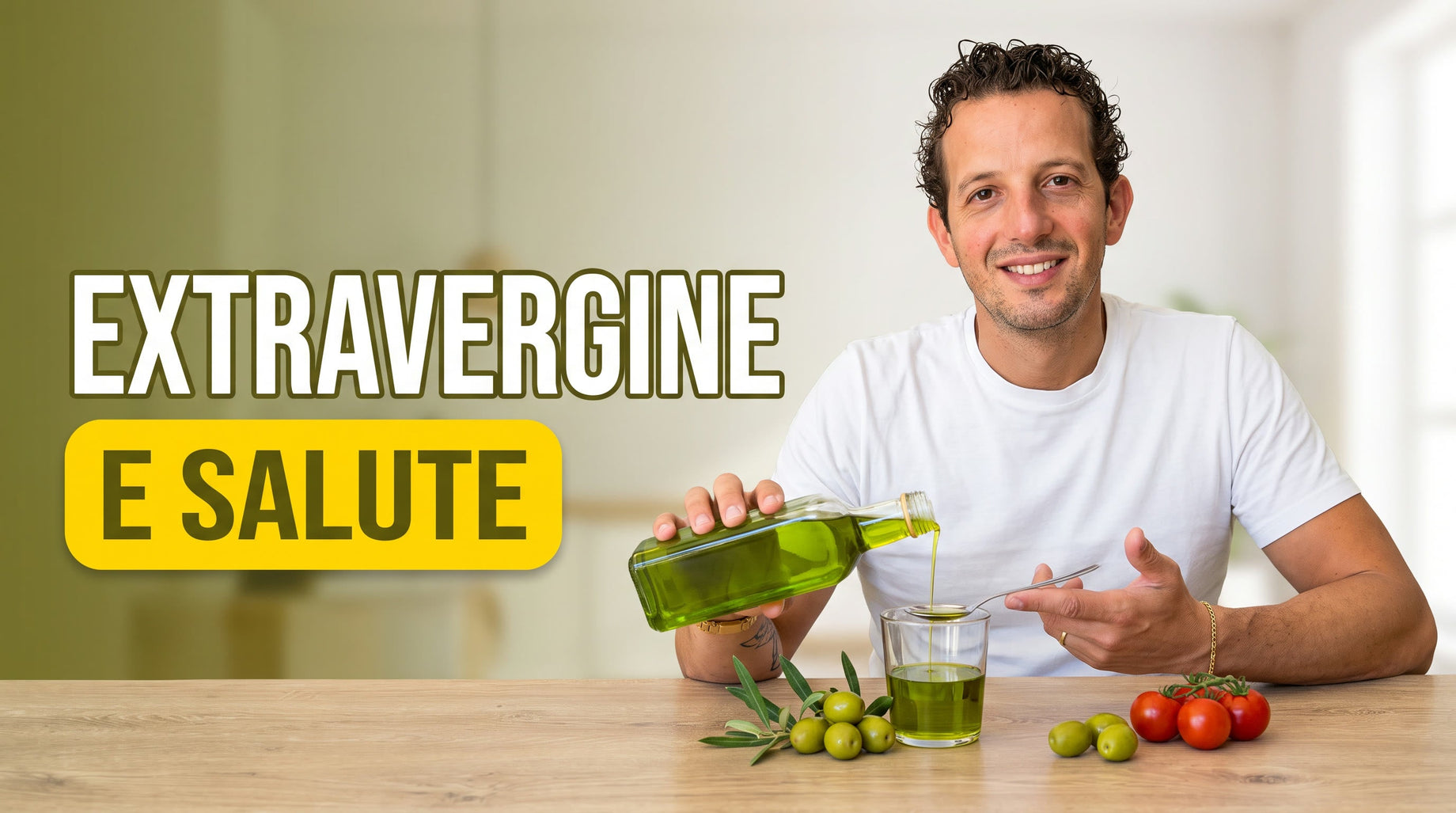 Antonio Carbone versa olio extravergine di oliva verde su un cucchiaio, con olive fresche e un bicchiere d'olio: extravergine e salute