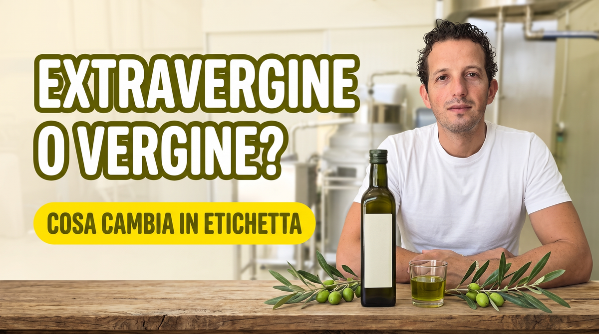 Antonio Carbone al bancone in frantoio con una bottiglia di olio extravergine, per l'articolo su extravergine o vergine e cosa cambia in etichetta